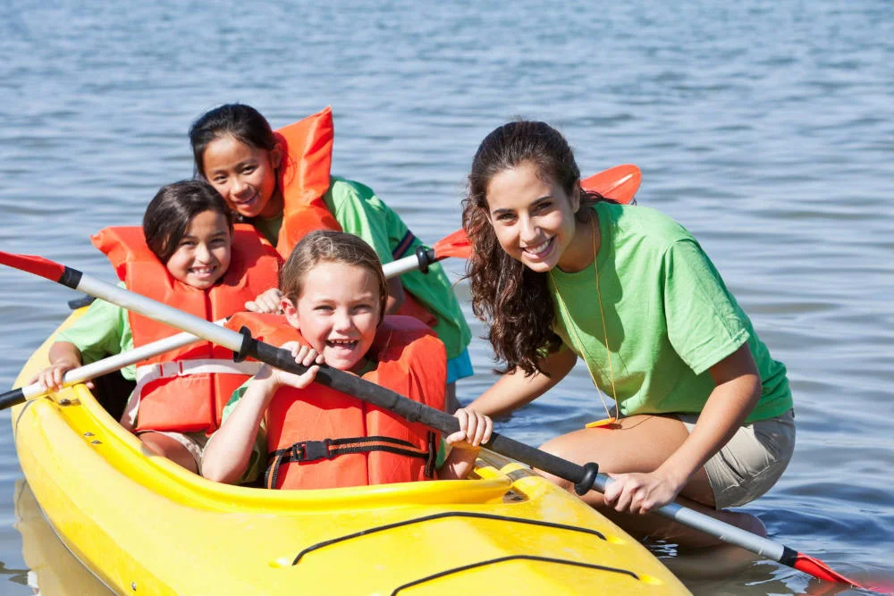Campers in a Kayak with counselors